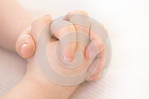 Child folding hands for prayer