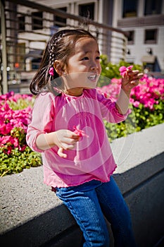 Small Child girl Holdling Flower