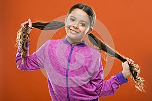 Small child long hair. Charming beauty. Girl active kid with long gorgeous hair. Strong and healthy hair concept. How to