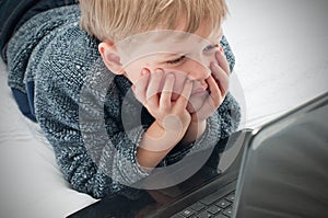 Small child looking at online web pages