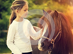 Small child and pony