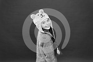 Small child ready for winter. happy little girl in earflap hat. holiday activity outdoor. seasonal health care. kid