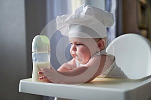 A small child is sitting in a chair and wants to eat