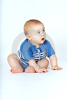 A small child sitting on the floor