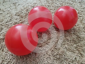 Small children`s balls of red Plastics photo