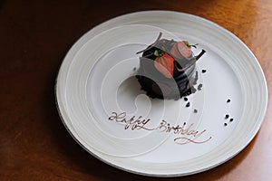 small chocolate cake with strawberry with words \
