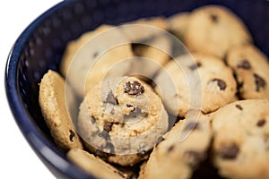 Small chocolate chip breakfast cookies in cereal bowl close up