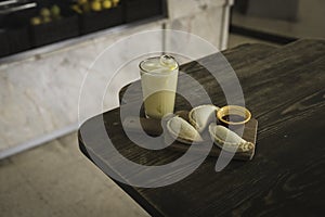 Small chopping board displaying typical food from Portugal and South America, Chicken and Beef Empanada favored with spicy and