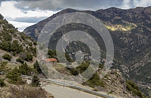 A small Christian church in the mountains by the road