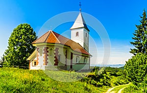 Small church of Cerkev sv. Ahaca by kamnik in the mountains of Slovenia