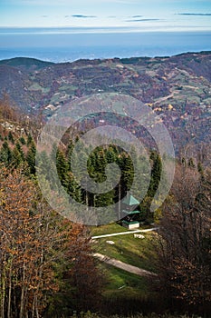 Small church on a mountain meadow surrounded by forest, Bobija mountain