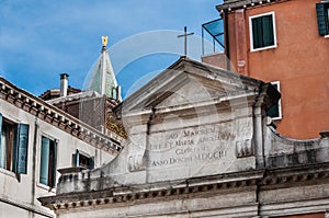 Small church and St Marks Campanile with gilden angel