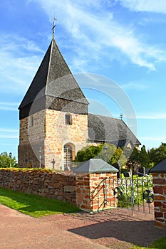 Small church with wooden shingle roof in Aland Islands.