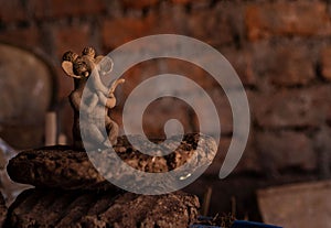 Small clay made lord ganesh kept on a cow dung cake