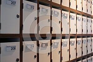 Small closed mail lockers in wooden boxes