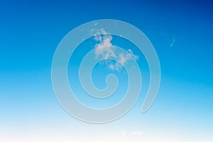 Small cloud in the blue sky, background, copy space for text