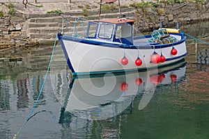 A Small Coastal Fishing Boat Moored in Harbour