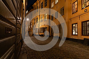 Small cobbled street in the old town of Stockholm, Sweden at night