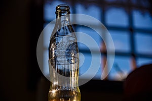 small Coca-Cola bottle backlit