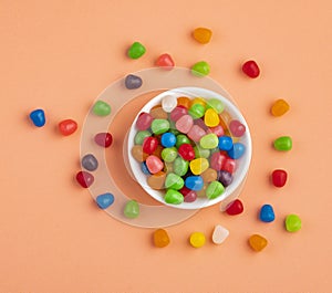 Small colored candies in the ceramic bowl
