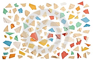 Small colored ripped pieces of paper cut out and isolated on white or transparent background, isolated confetti as graphic element