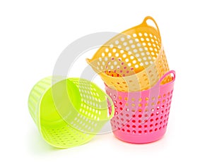 Small and colorful baskets on white background