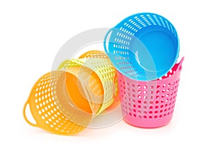 Small and colorful baskets on white background