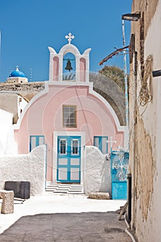 Small colorful church at Oia village, Santorini island