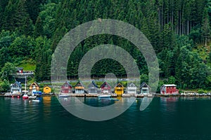 Small colorful houses on the coast of a fjord in Norway