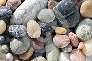Small colorful pebbles background, simplicity, daylight, stones, white, green, grey, red, orange,