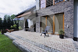 Small concrete terrace with furnitures photo