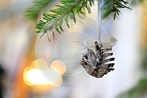 A small cone is a Christmas tree decoration. Christmas and New Year holiday