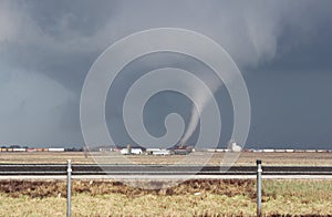 Small cone tornado with debris