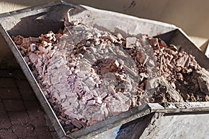 Small container with rubble of demolition