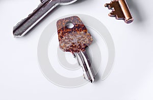 Small corroded key on white background 2