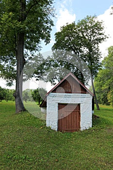 Small cosy white brick warehouse in the forest