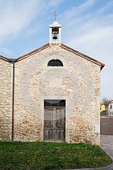 Small country church with adjoining bell tower with a single bell