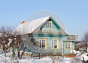 Small country wooden house, winter time