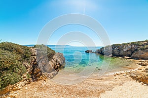 Small cove under a shining sun in Alghero shore