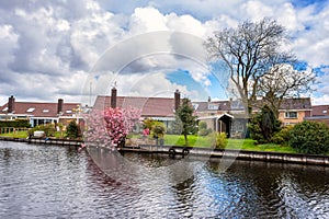 Small cozy dutch village at springtime, beautiful daytime countryside landscape, Netherlands