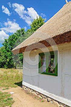 Small cozy houses. Wooden ancient buildings. Summer village and vacation. Farm bio products.