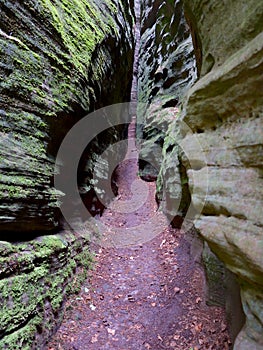 Footway Through a Crack Between the Rocks at the SiewenschlÃÂ¼ff on the Mullerthal Trail in Berdorf, Luxembourg photo