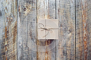 Small craft gift box on empty wooden table
