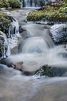 Small creek with a waterfall close-up