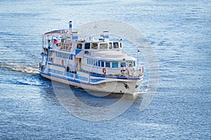 Small cruise ship on the blue water