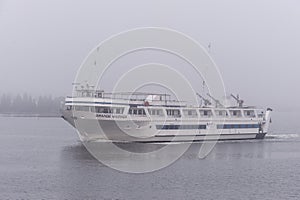 Small cruise ship Grande Mariner outbound in fog