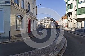 Small curved street in the downtown. Lille, France.