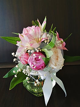 Flowers cute bouquet with roses and alstroemerias pink white green, wooden box photo