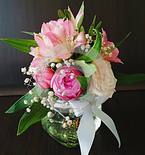 Flowers cute bouquet with roses and alstroemerias pink white green, wooden box photo