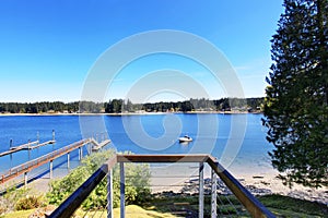 Small deck of luxurious home with an amazing view of lake.